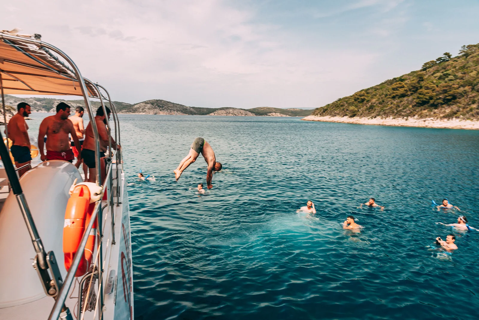 Guest diving from the Summer Blues catamaran into open water